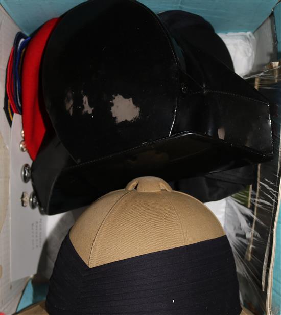 A Northern Rhodesian policemans hat, a Spanish policemans hat, various hat and related buttons, badges, etc.